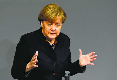 Merkel vows to stand by refugee policy despite security concerns