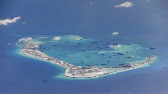 China ‘deploys fighter jets’ to contested island in South China Sea