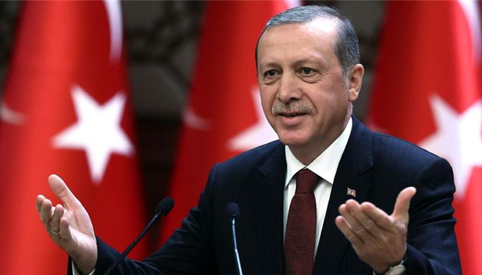 Turkey’s Erdogan threatens to open borders to migrants