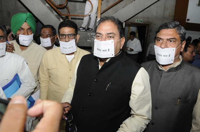 INLD MLAs arrive in Haryana Assembly with mouths gagged