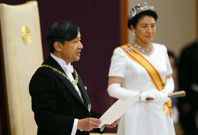 Japan’s Emperor Naruhito pledges to work as symbol of the people