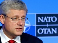 Harper defends government against harsh criticism from Mulroney