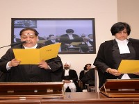 Acting chief justice adminsters the oath of office to 12 additional judges