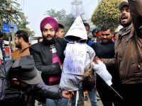 Effigy-burning outside ED office as minister Majithia faces heat inside